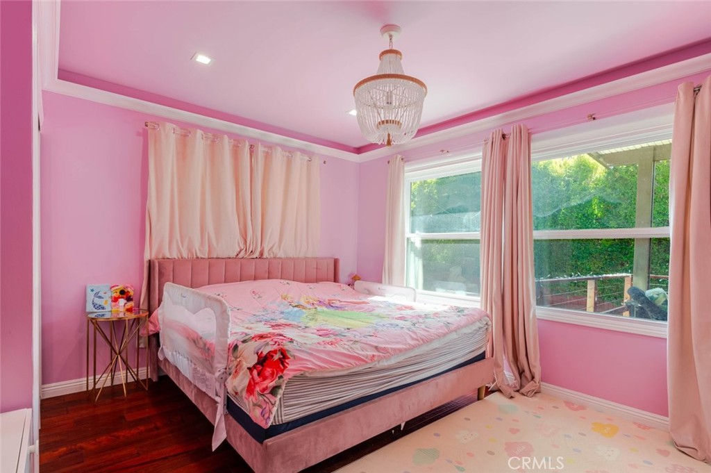 660 Woodbury Road Glendale, CA 91206 - Photo 19 of 45 a bed room with a bed and a window