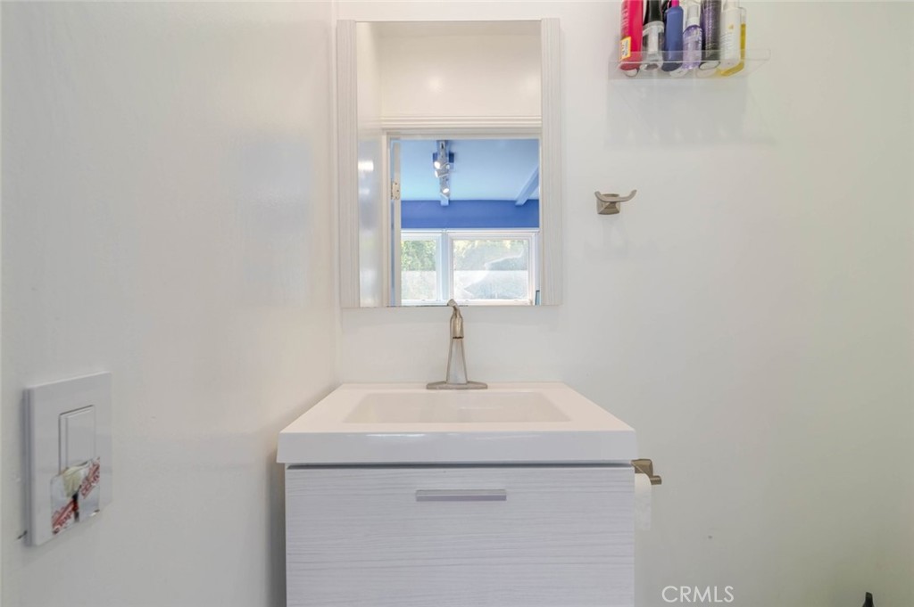 660 Woodbury Road Glendale, CA 91206 - Photo 22 of 45 a bathroom with a sink and a mirror