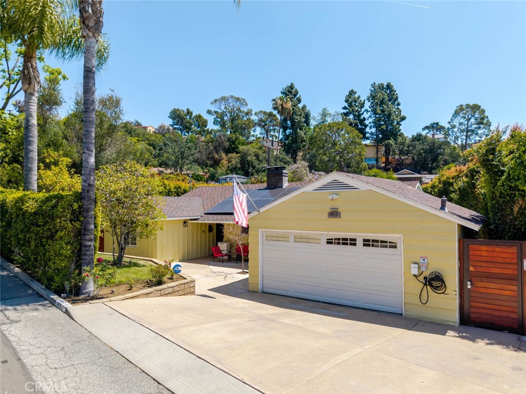 660 Woodbury Road Glendale, CA 91206 - Photo 3 of 45 a front view of a house with a garden