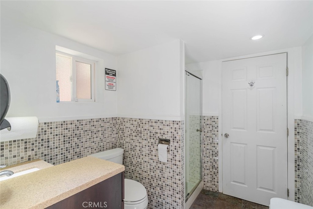 660 Woodbury Road Glendale, CA 91206 - Photo 37 of 45 a bathroom with a toilet and a sink