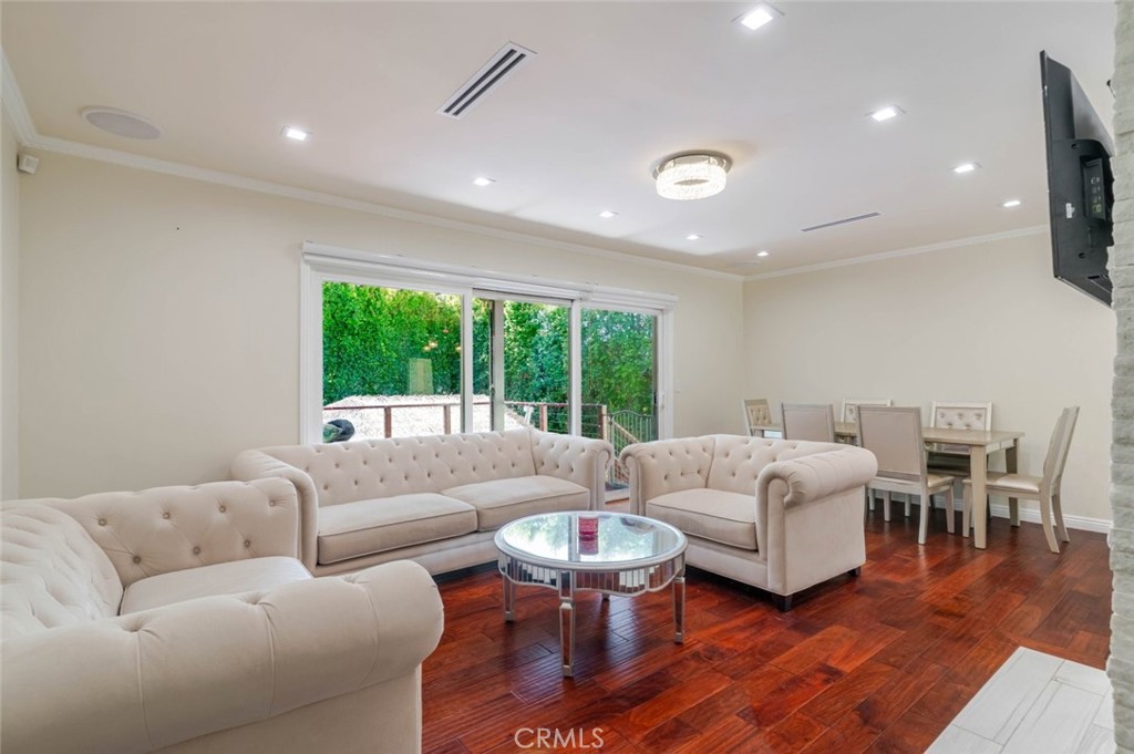 660 Woodbury Road Glendale, CA 91206 - Photo 4 of 45 a living room with furniture and a large window