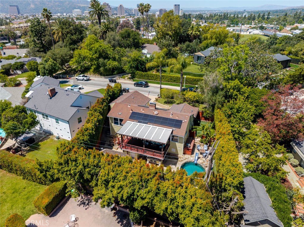 660 Woodbury Road Glendale, CA 91206 - Photo 43 of 45 an aerial view of a house with a yard swimming pool outdoor seating and yard