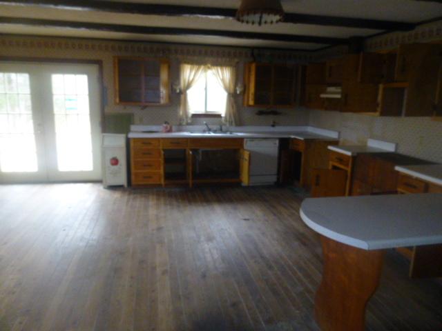 490 Powell Hollow Road Tullahoma, TN 37388 - Photo 3 of 10 Large open kitchen and dining area. Plenty of cabinets for storage and countertops for baking