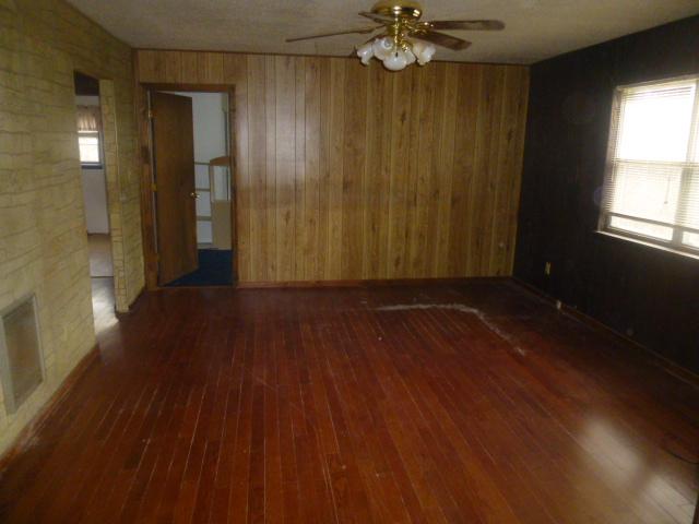 490 Powell Hollow Road Tullahoma, TN 37388 - Photo 5 of 10 Living Room with Hardwood, flooring ceiling fan, and lots of natural light from the big picture window