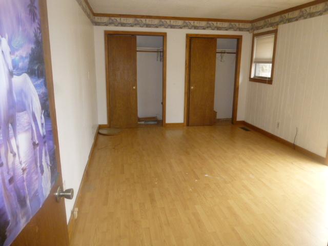 490 Powell Hollow Road Tullahoma, TN 37388 - Photo 9 of 10 This bedroom has laminate flooring and double closets.