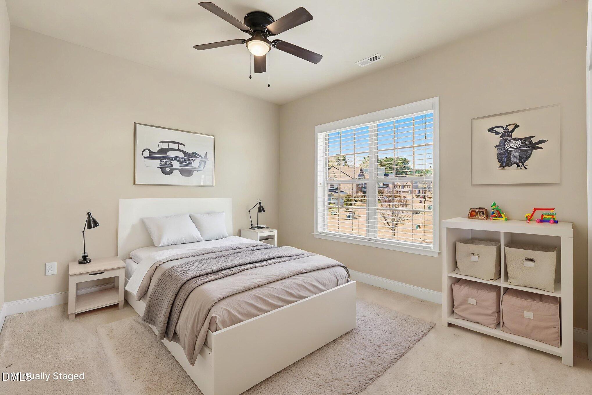 351 Gartrell Way Cary, NC 27519 - Photo 30 of 51 a bedroom with a bed and a painting on the wall