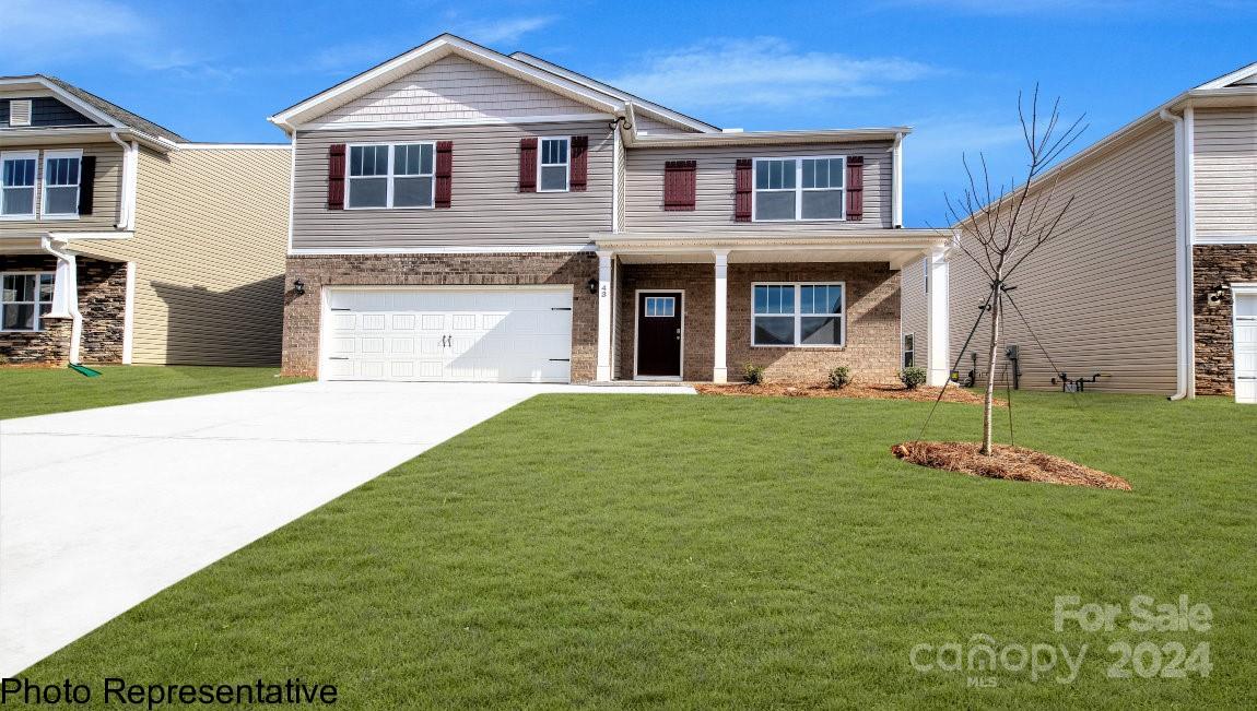 244 Wheatfield Road Fletcher, NC 28732 - Photo 1 of 29 a front view of a house with a yard and porch