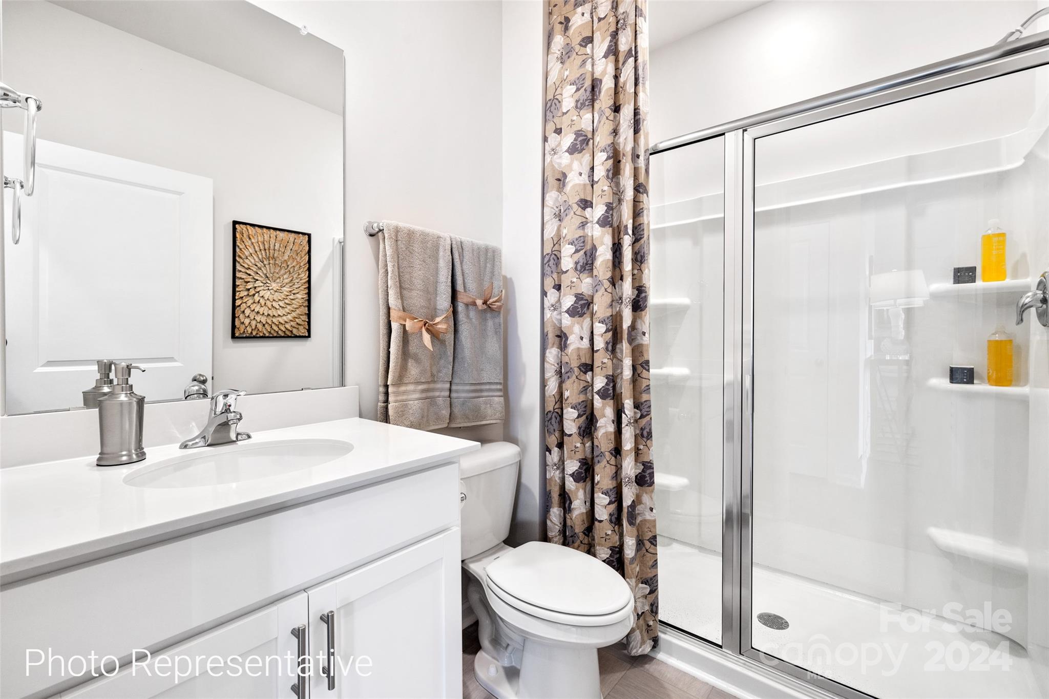 244 Wheatfield Road Fletcher, NC 28732 - Photo 15 of 29 a bathroom with a sink toilet and shower