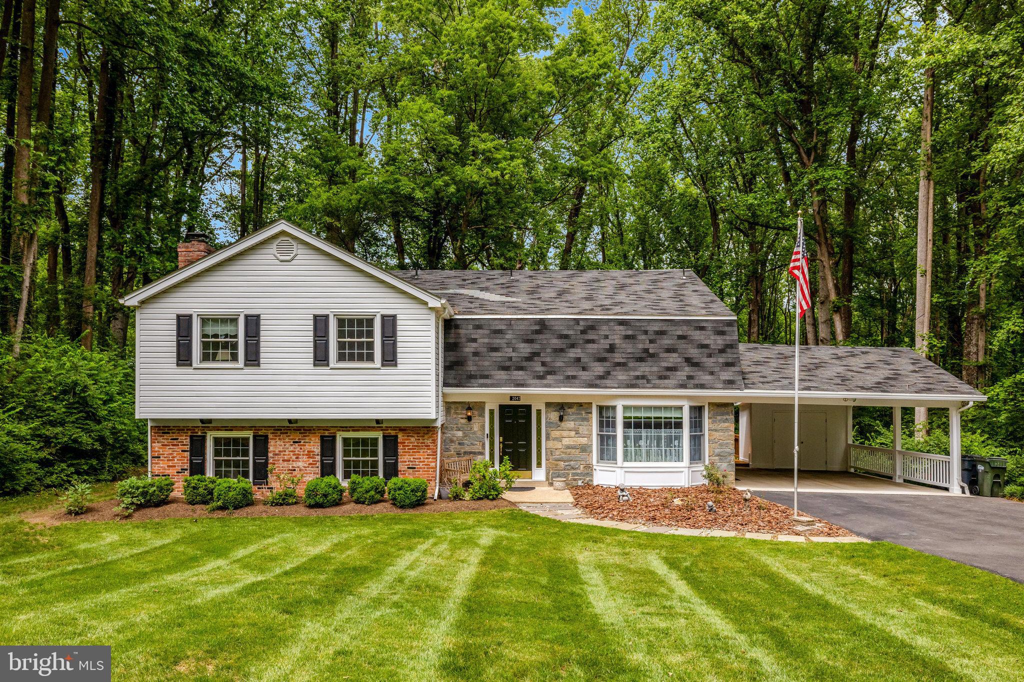 a front view of a house with a garden and porch
