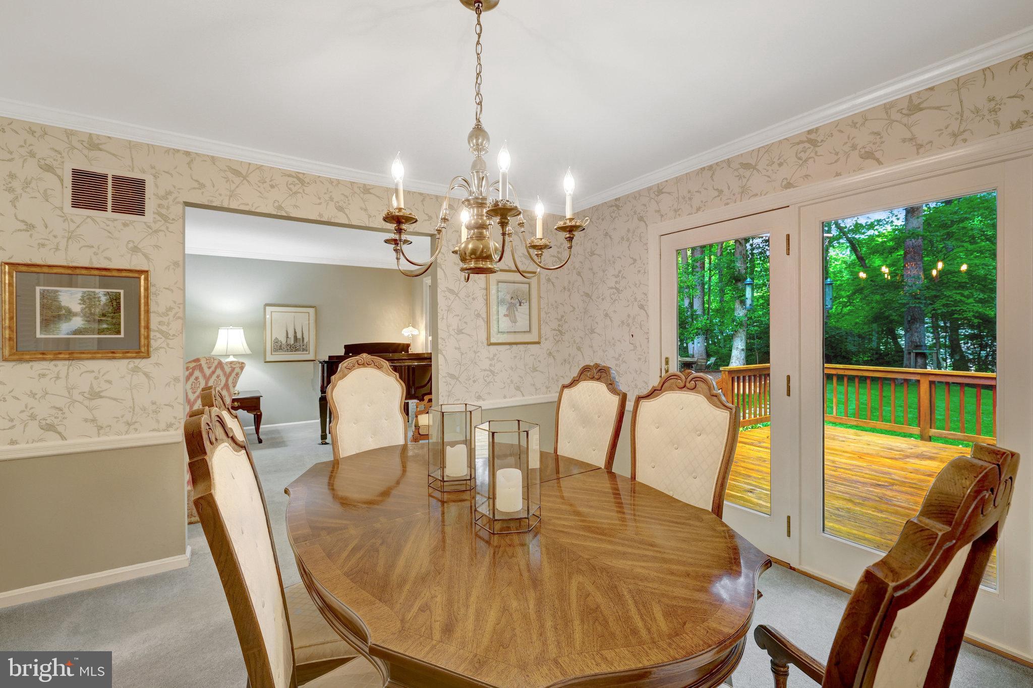 2042 Carrhill Road Vienna, VA 22181 - Photo 15 of 80 a dining room with furniture a chandelier and window