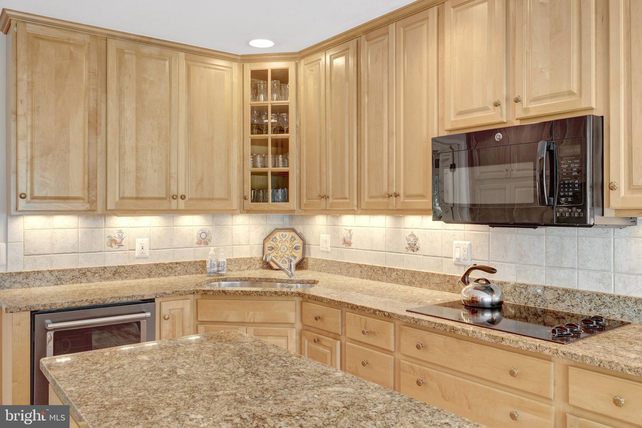 2042 Carrhill Road Vienna, VA 22181 - Photo 20 of 80 a kitchen with stainless steel appliances granite countertop a sink a stove and cabinets