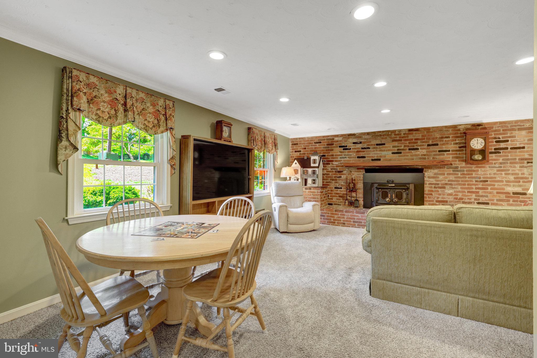 2042 Carrhill Road Vienna, VA 22181 - Photo 27 of 80 a living room with furniture a flat screen tv and a large window