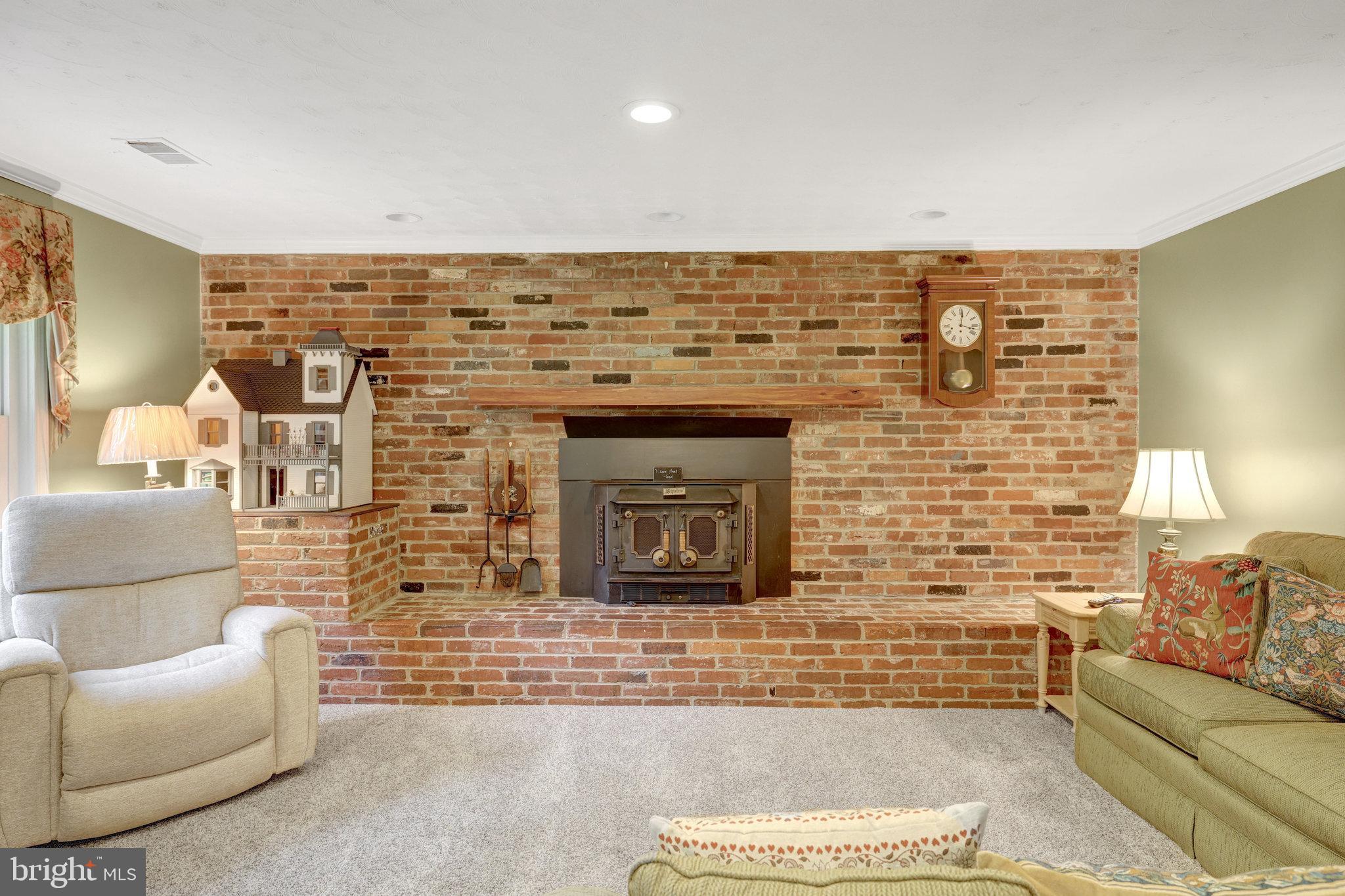 2042 Carrhill Road Vienna, VA 22181 - Photo 31 of 80 a living room with furniture and a fireplace