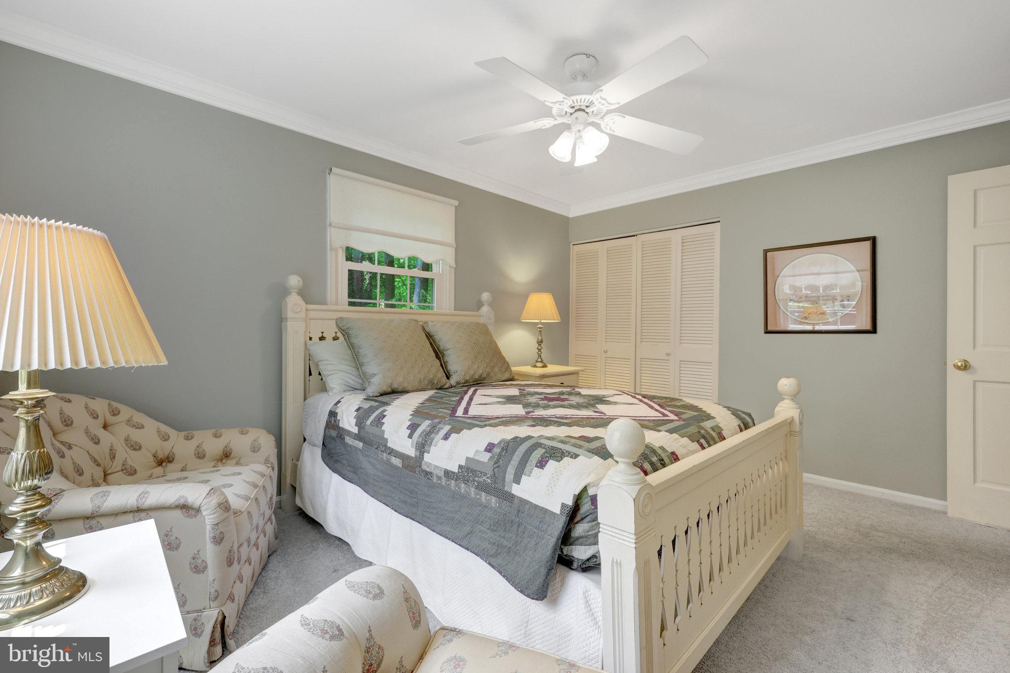 2042 Carrhill Road Vienna, VA 22181 - Photo 39 of 80 a bedroom with a bed and a chandelier