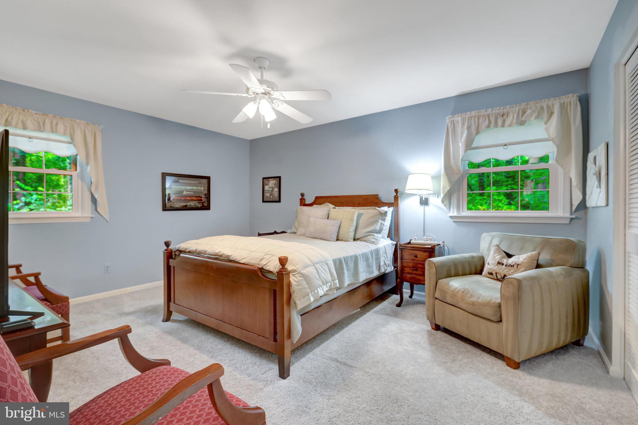 2042 Carrhill Road Vienna, VA 22181 - Photo 46 of 80 a bedroom with a bed and a couch