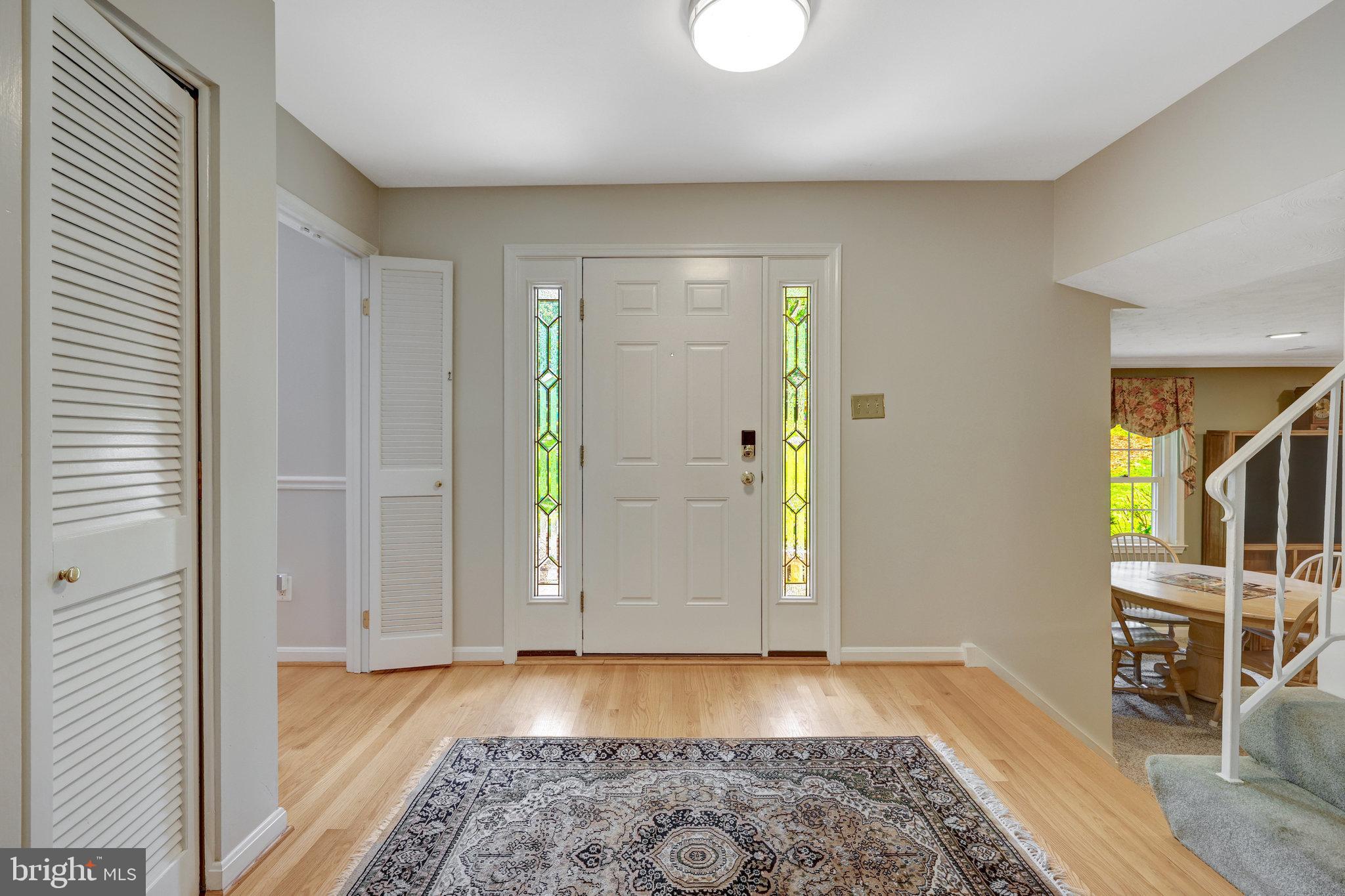 2042 Carrhill Road Vienna, VA 22181 - Photo 5 of 80 a view of a room with wooden floor and furniture