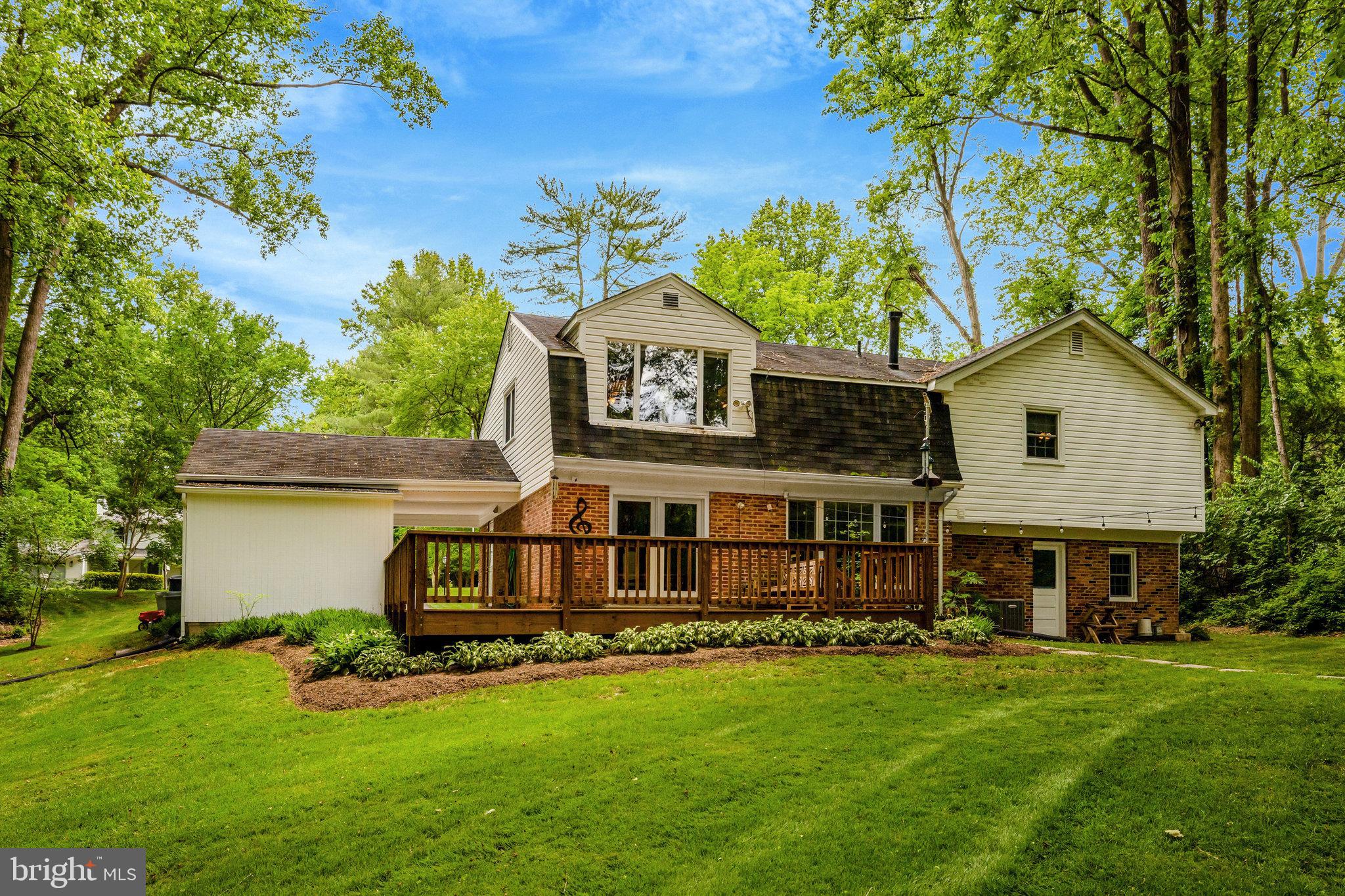 2042 Carrhill Road Vienna, VA 22181 - Photo 72 of 80 a front view of a house with a garden and deck