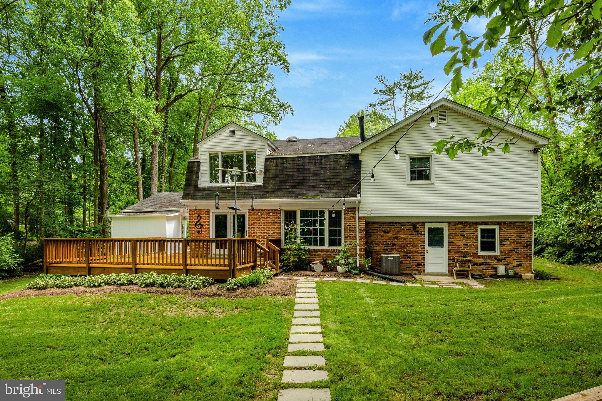2042 Carrhill Road Vienna, VA 22181 - Photo 73 of 80 a front view of a house with a yard table and chairs