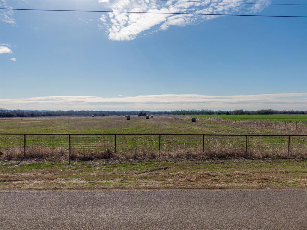 0 Ozro Road Venus, TX 76084 - Photo 5 of 18 a view of a yard with wooden fence