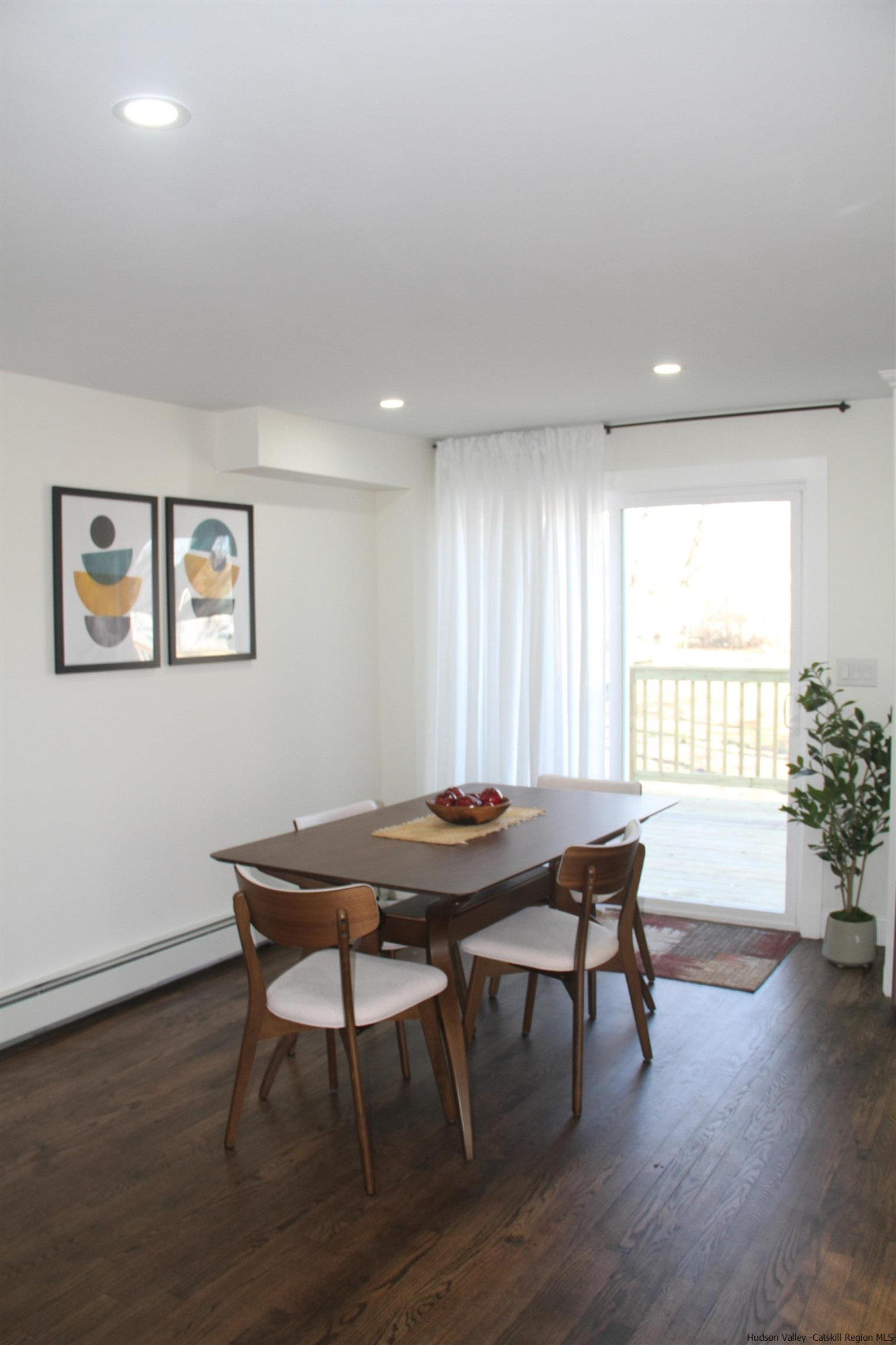 246 Jefferson Heights Catskill, NY 12414 - Photo 11 of 35 a view of a dining room with furniture window and wooden floor