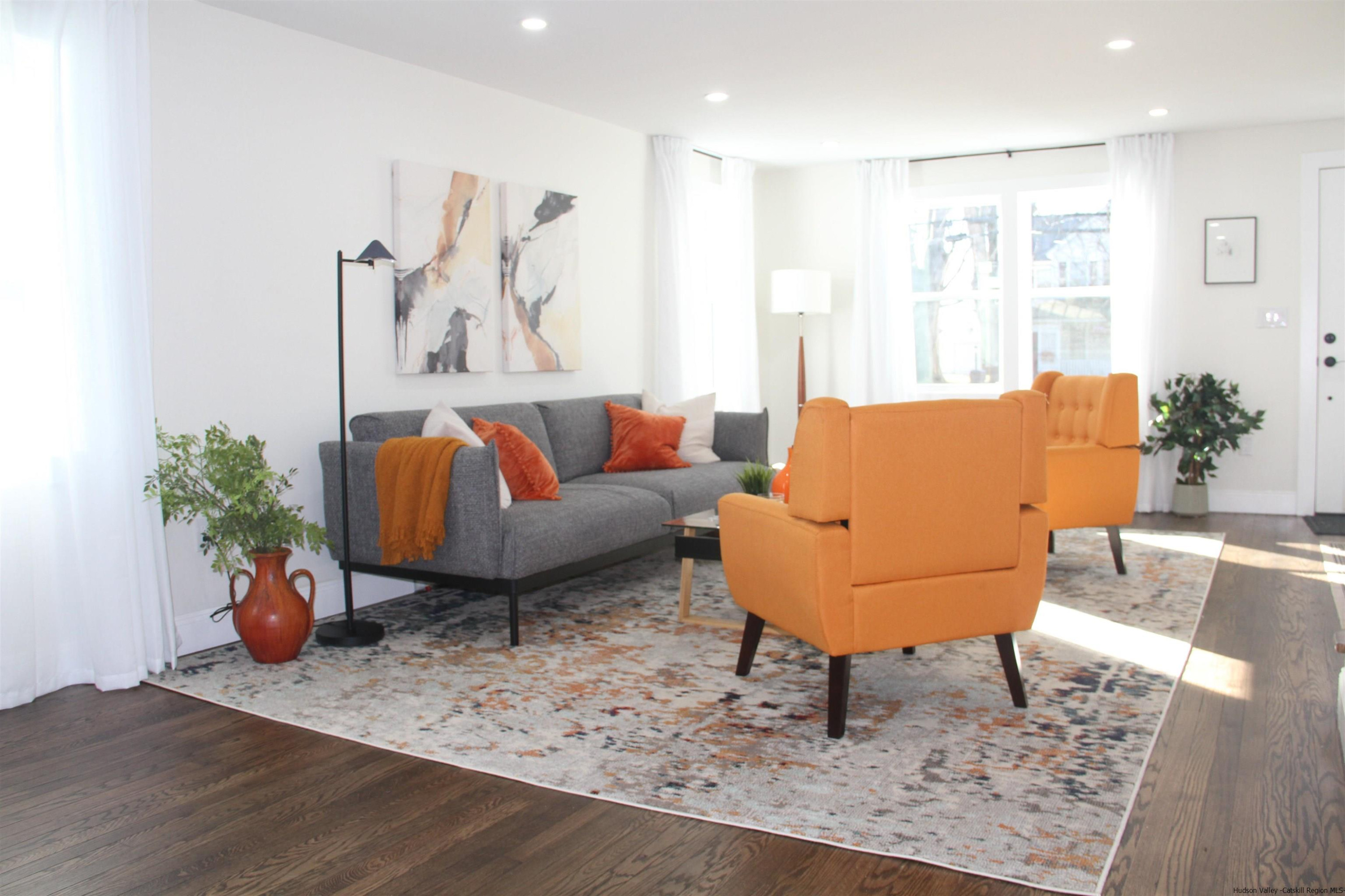 246 Jefferson Heights Catskill, NY 12414 - Photo 2 of 35 a living room with furniture and a potted plant