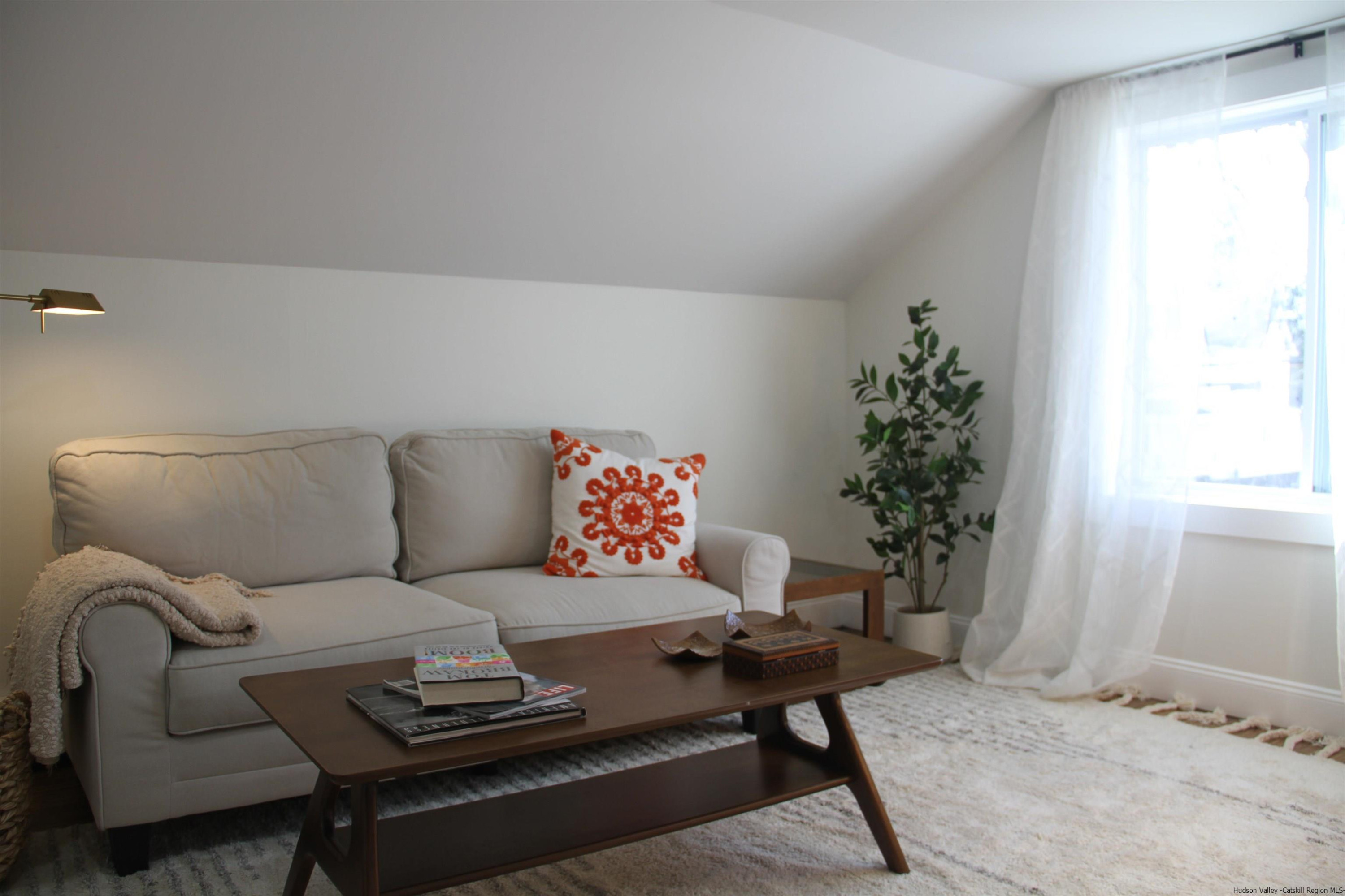 246 Jefferson Heights Catskill, NY 12414 - Photo 24 of 35 a living room with furniture and a potted plant
