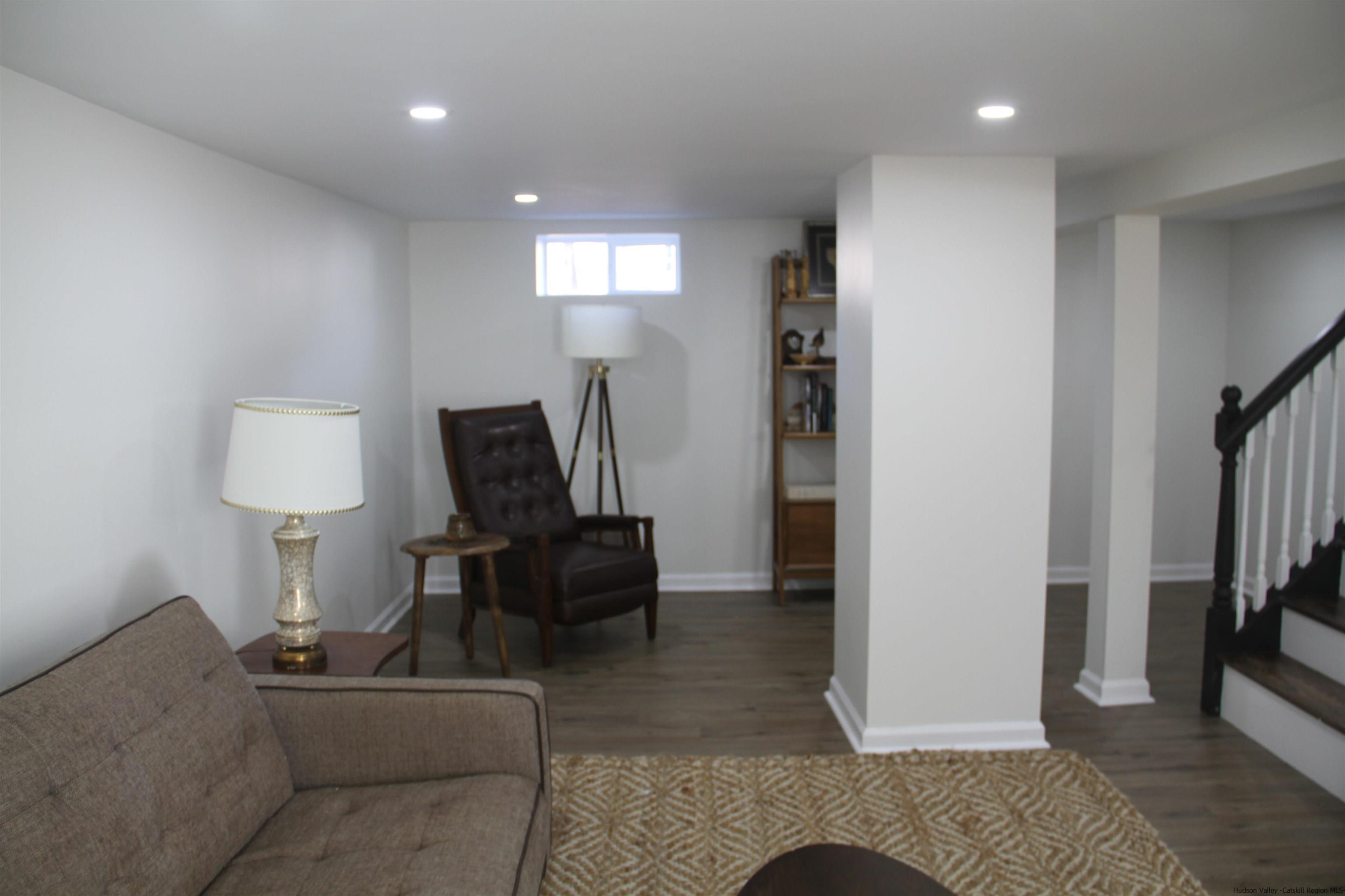 246 Jefferson Heights Catskill, NY 12414 - Photo 26 of 35 a living room with furniture and a lamp