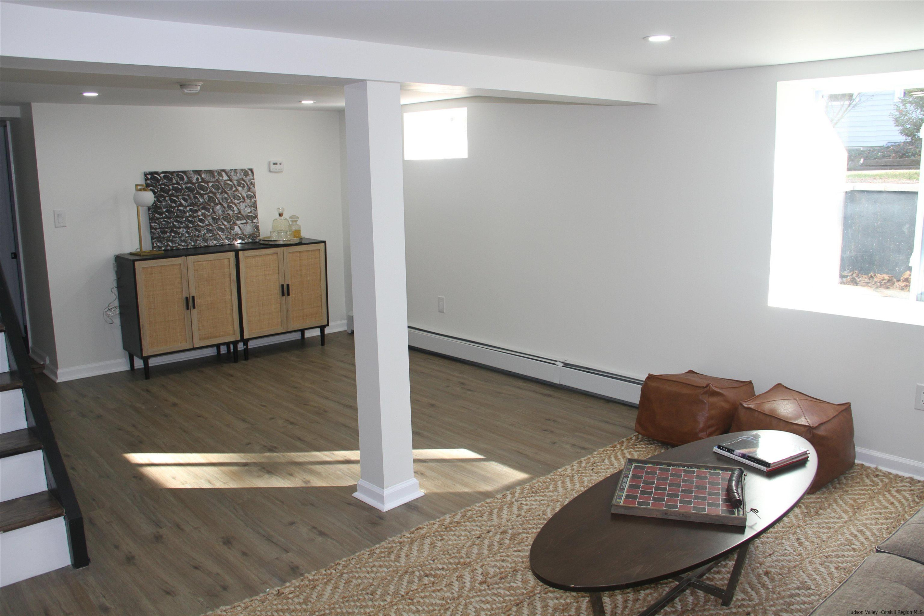 246 Jefferson Heights Catskill, NY 12414 - Photo 27 of 35 a living room with furniture and a mirror