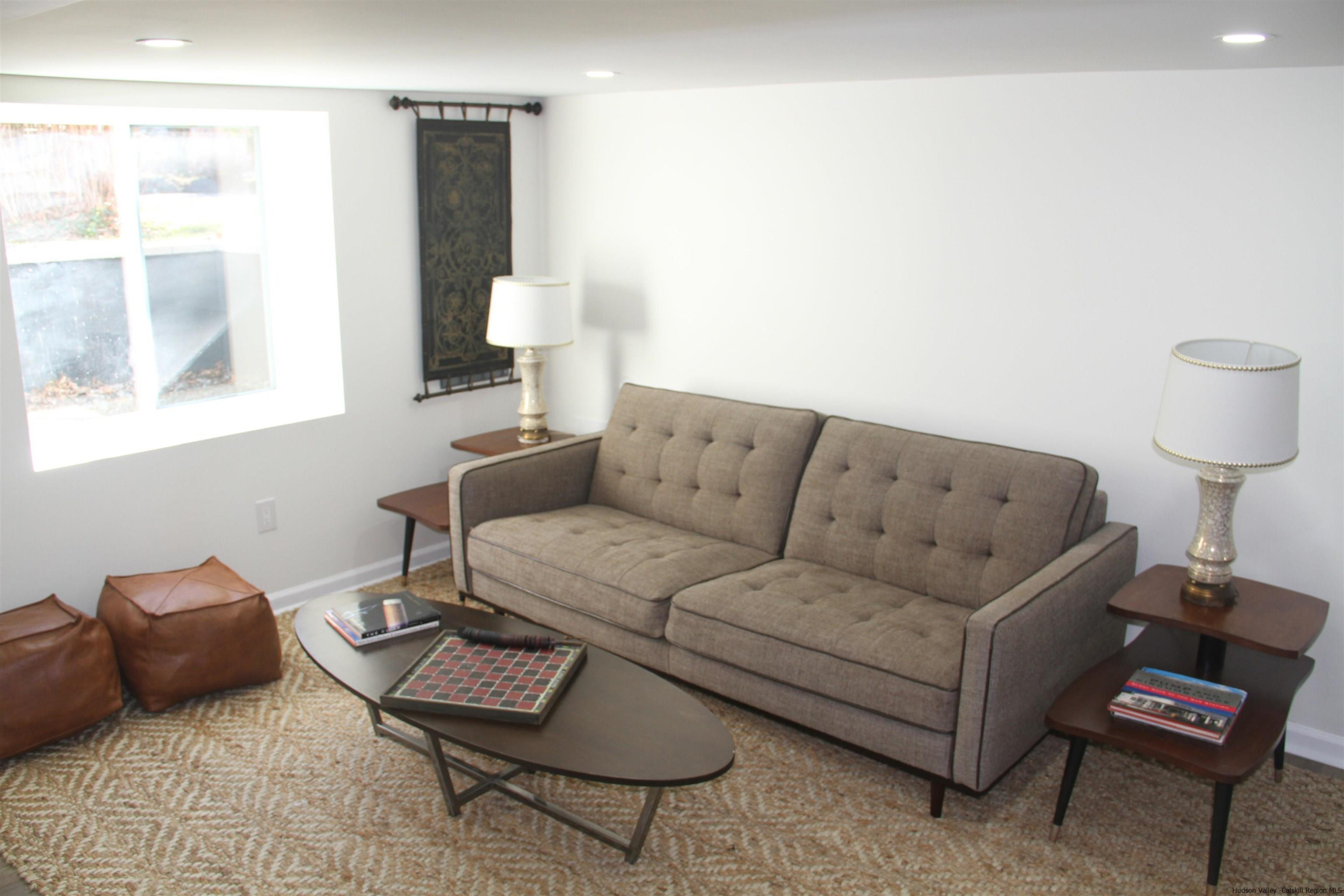 246 Jefferson Heights Catskill, NY 12414 - Photo 28 of 35 a living room with furniture and a window
