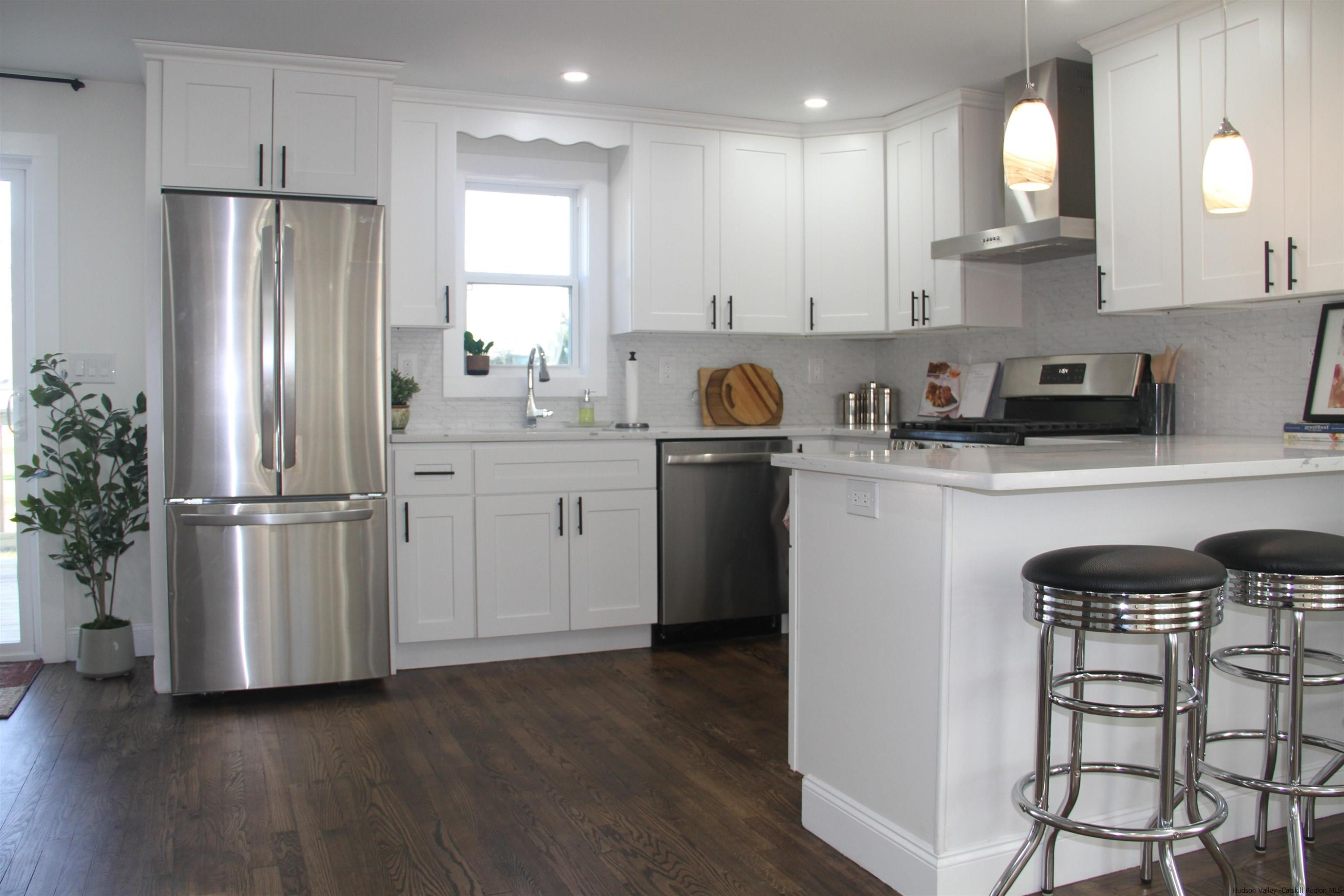 246 Jefferson Heights Catskill, NY 12414 - Photo 6 of 35 a kitchen with stainless steel appliances granite countertop a refrigerator sink and cabinets