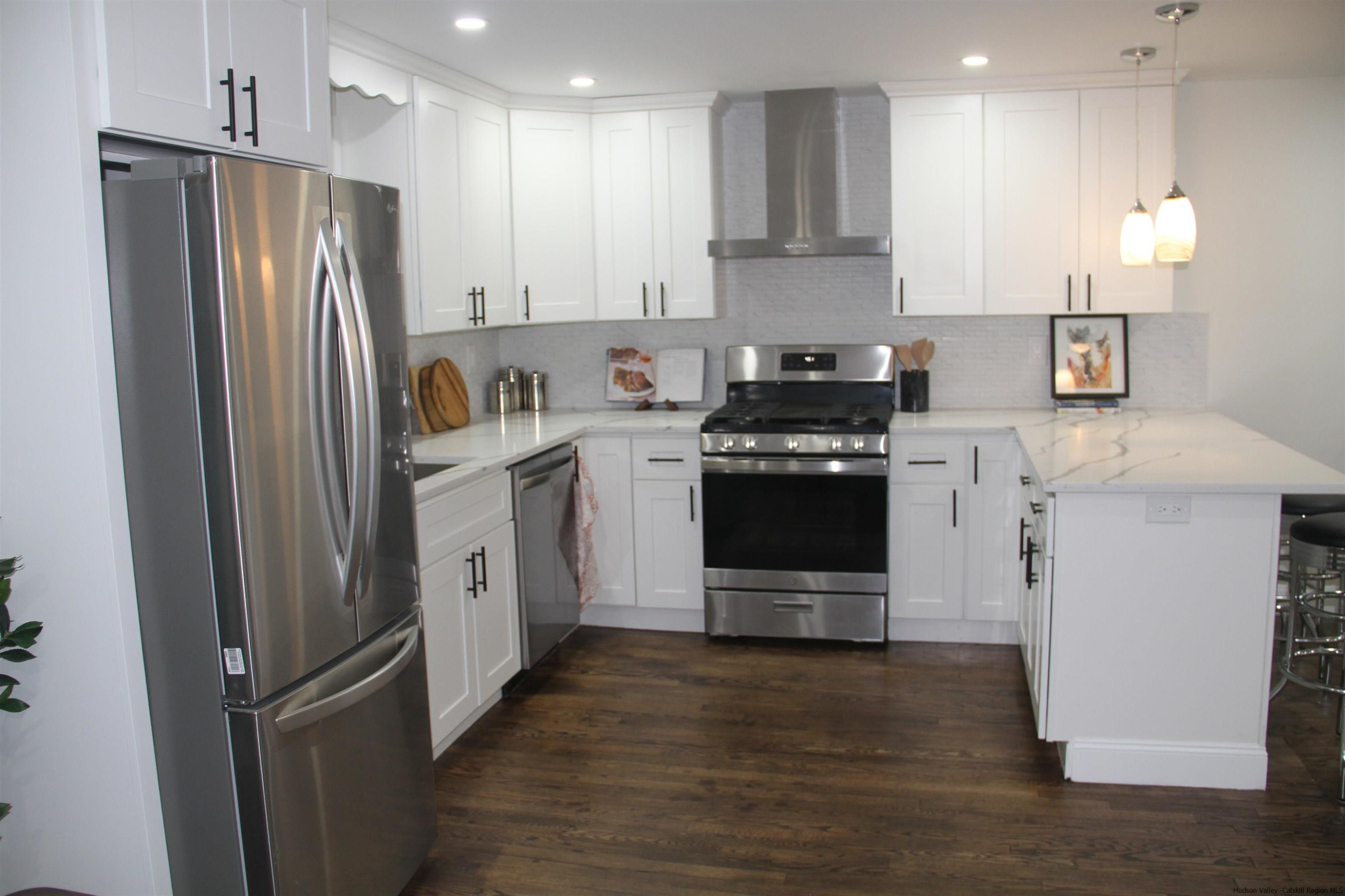 246 Jefferson Heights Catskill, NY 12414 - Photo 8 of 35 a kitchen with stainless steel appliances granite countertop a refrigerator a stove a sink and a microwave