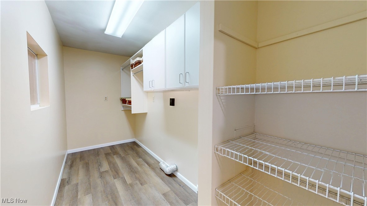102 Summit Road Marietta, OH 45750 - Photo 15 of 44 Main level laundry with lots of shelves and pantry