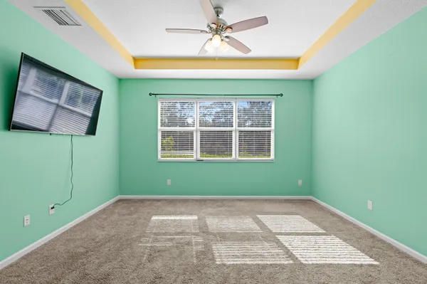 a view of room with window and fan