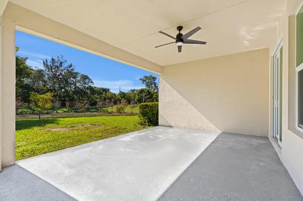 a view of a big room with a big yard and potted plants