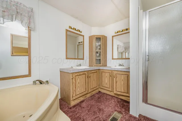 a bathroom with a sink toilet and mirror