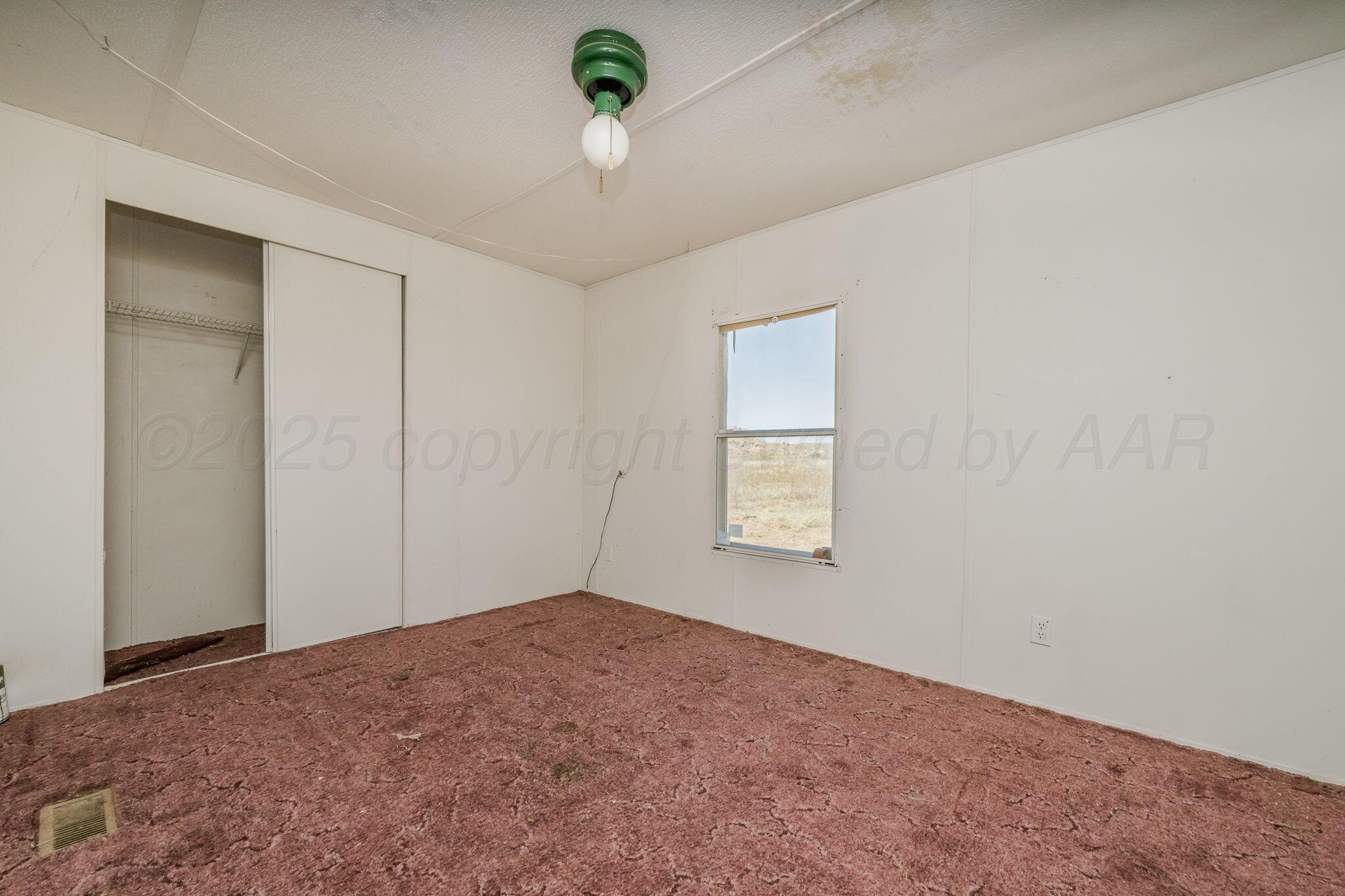 1061 Tascosa Road Amarillo, TX 79124 - Photo 17 of 31 a view of an empty room and a window