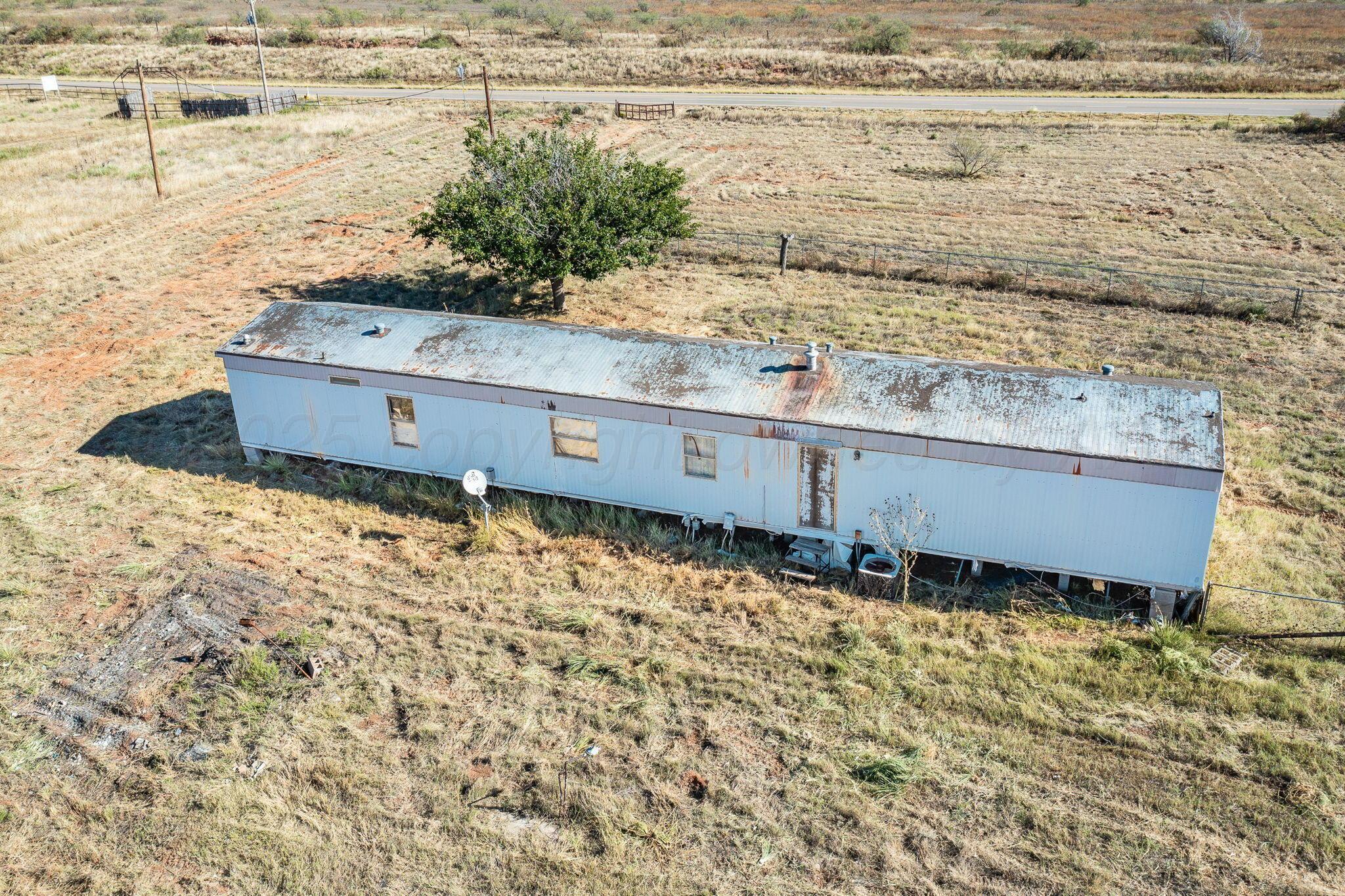 1061 Tascosa Road Amarillo, TX 79124 - Photo 30 of 31 a view of a water heater and wooden floor