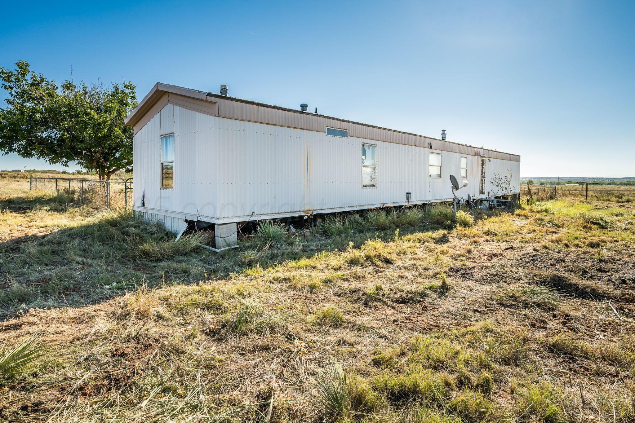 1061 Tascosa Road Amarillo, TX 79124 - Photo 6 of 31 a front view of a house with garden