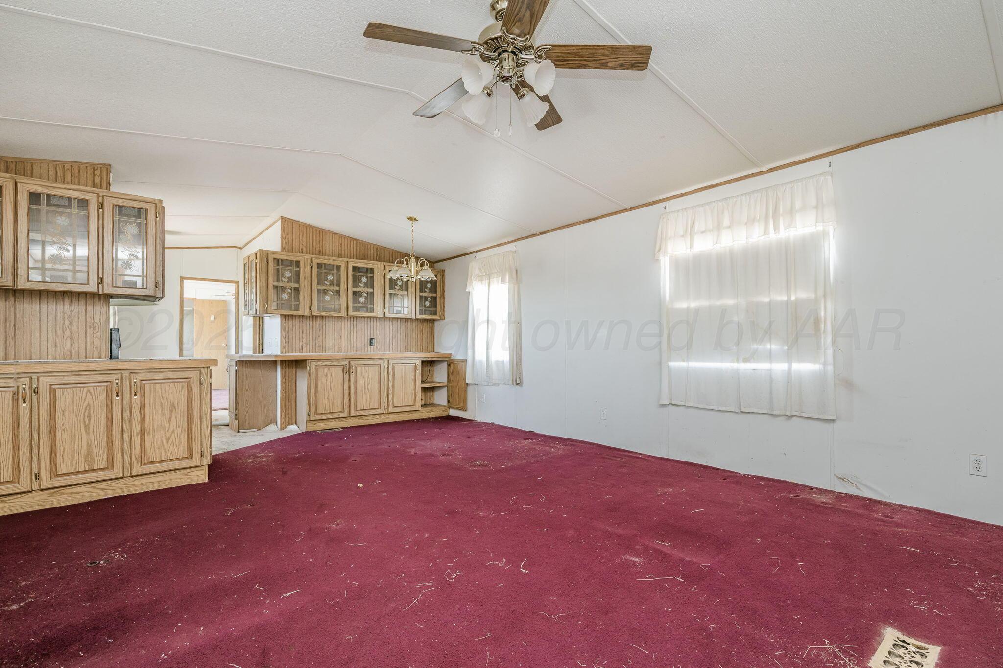 1061 Tascosa Road Amarillo, TX 79124 - Photo 7 of 31 a view of an empty room with a window