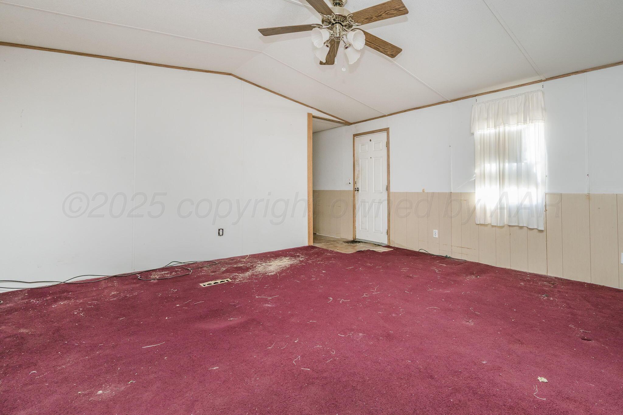 1061 Tascosa Road Amarillo, TX 79124 - Photo 8 of 31 a view of an empty room with a window