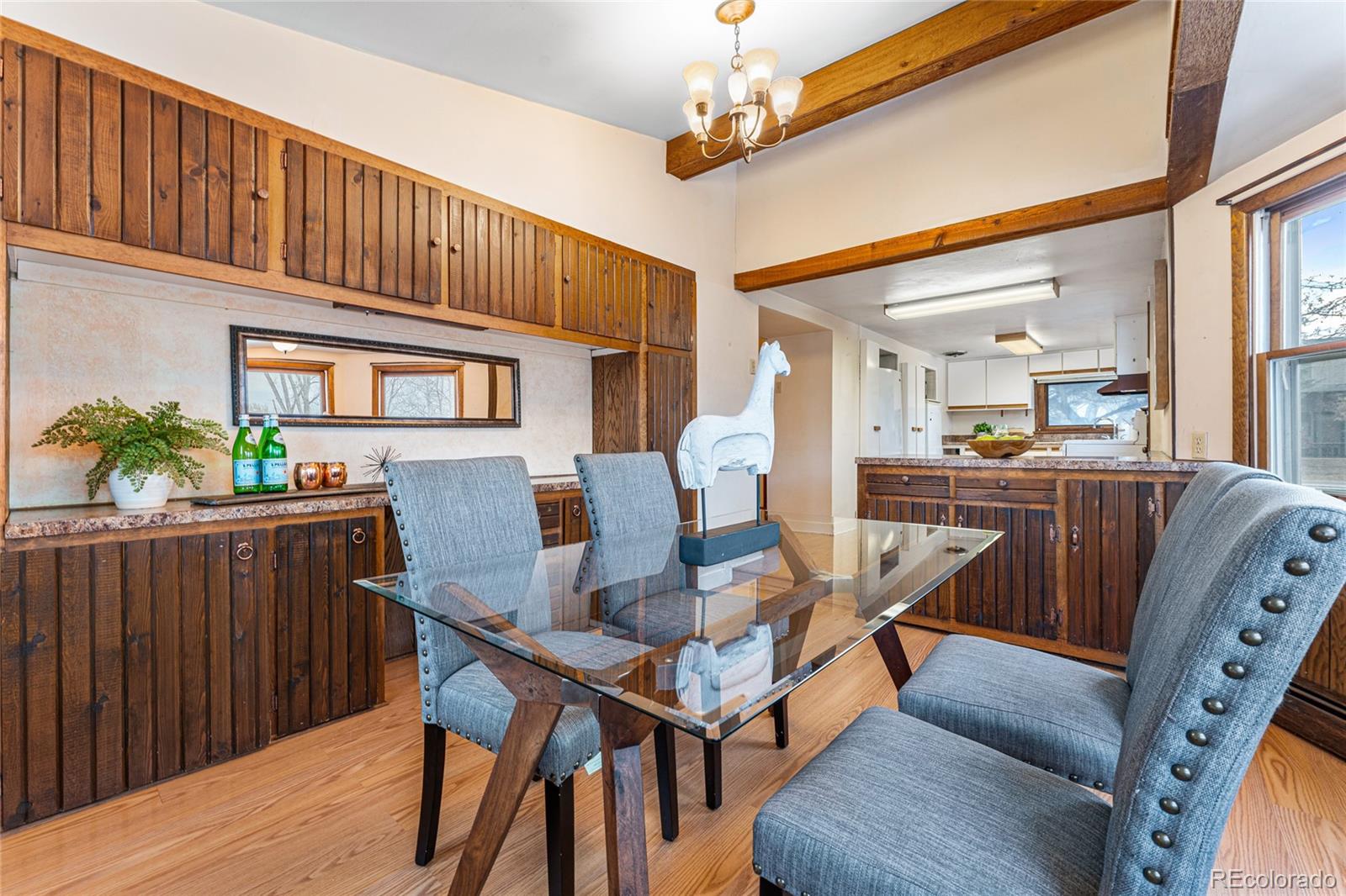 3152 Indian Road Boulder, CO 80301 - Photo 13 of 49 a dining room with furniture a window and wooden floor