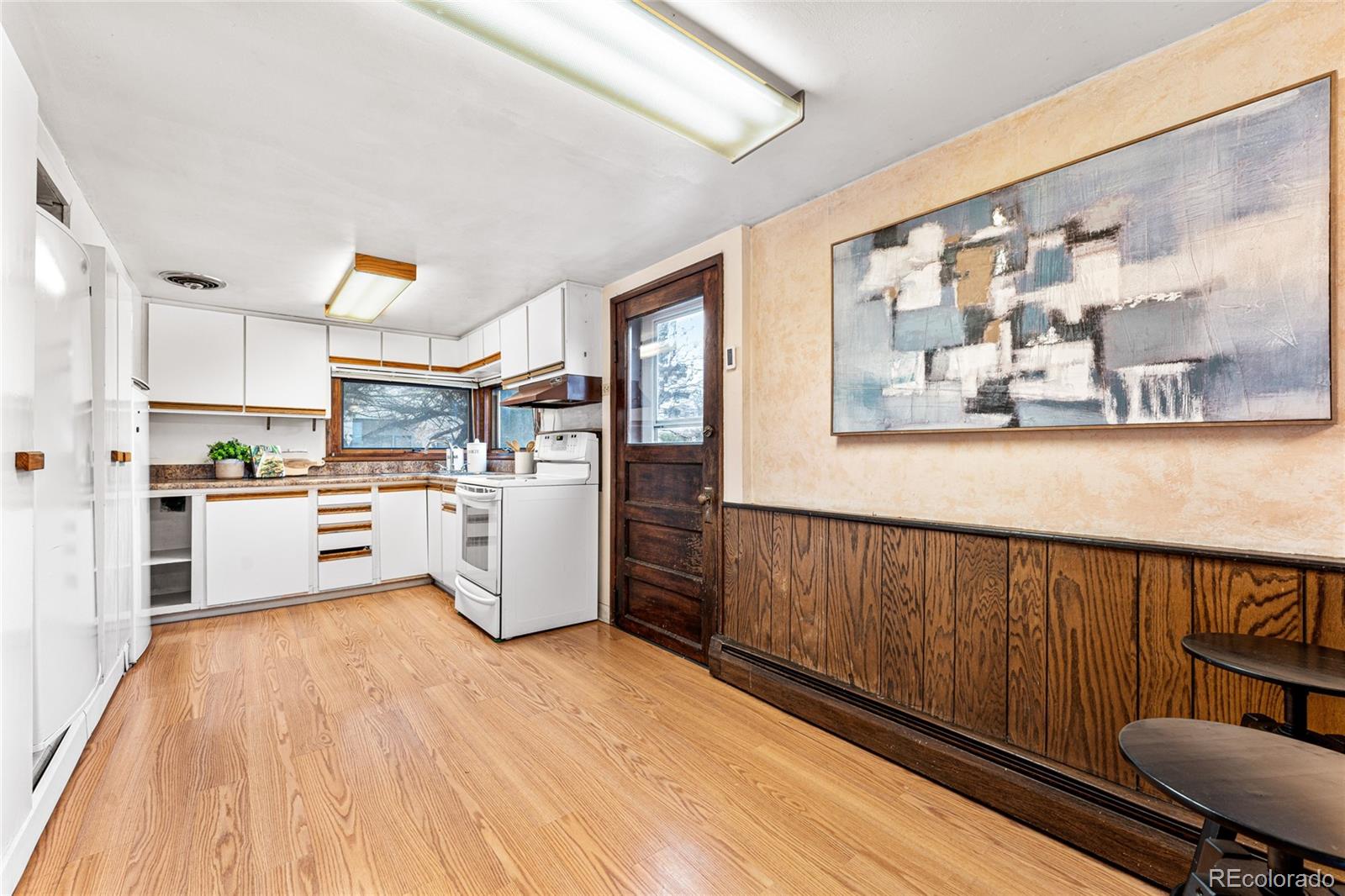 3152 Indian Road Boulder, CO 80301 - Photo 15 of 49 a kitchen with cabinets and wooden floor