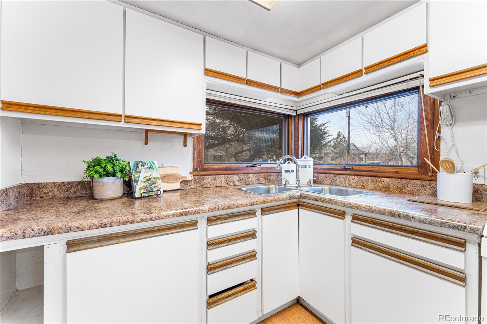 3152 Indian Road Boulder, CO 80301 - Photo 18 of 49 a kitchen with stainless steel appliances granite countertop a sink and a window