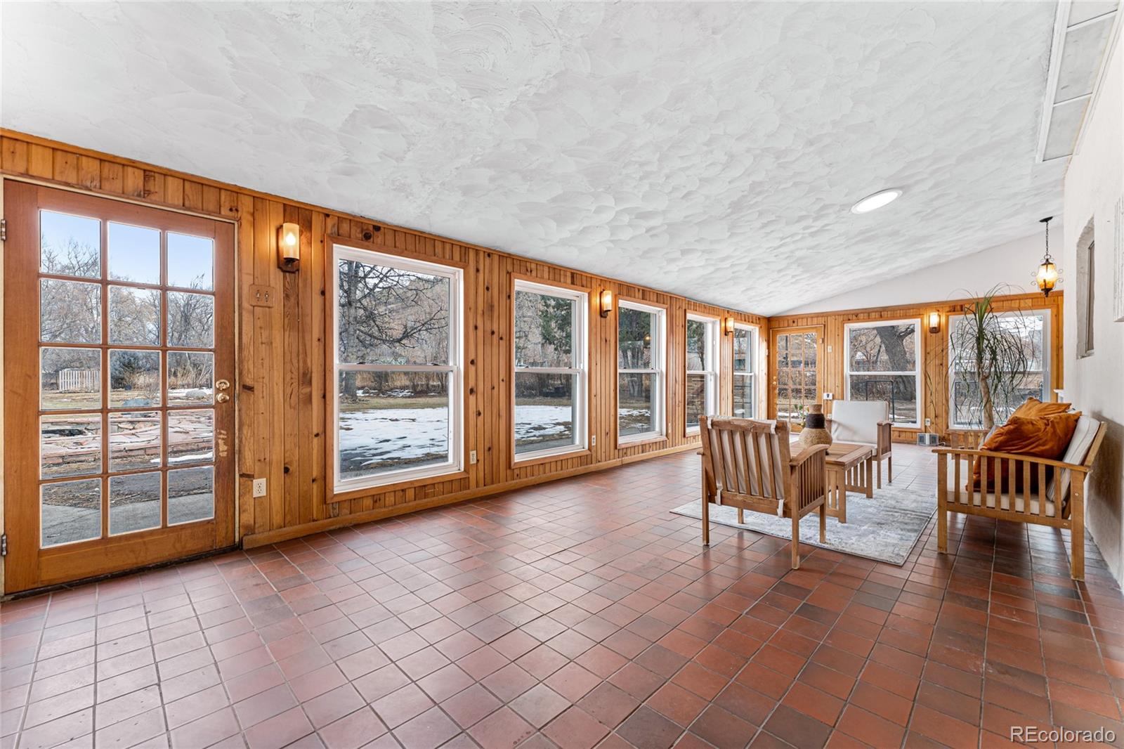 3152 Indian Road Boulder, CO 80301 - Photo 2 of 49 a view of workspace with furniture and floor to ceiling window