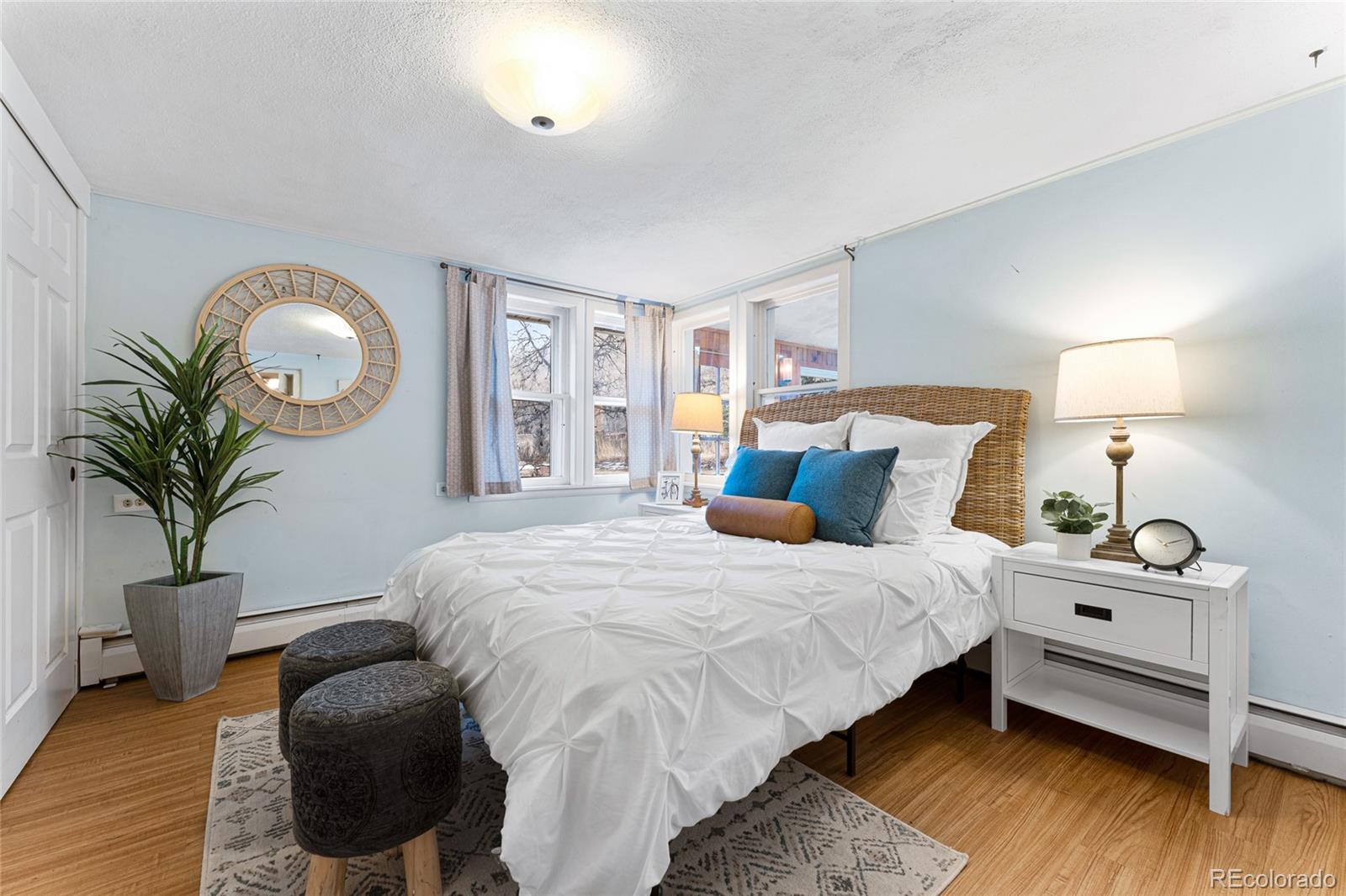 3152 Indian Road Boulder, CO 80301 - Photo 21 of 49 a bed room with a bed and a potted plant