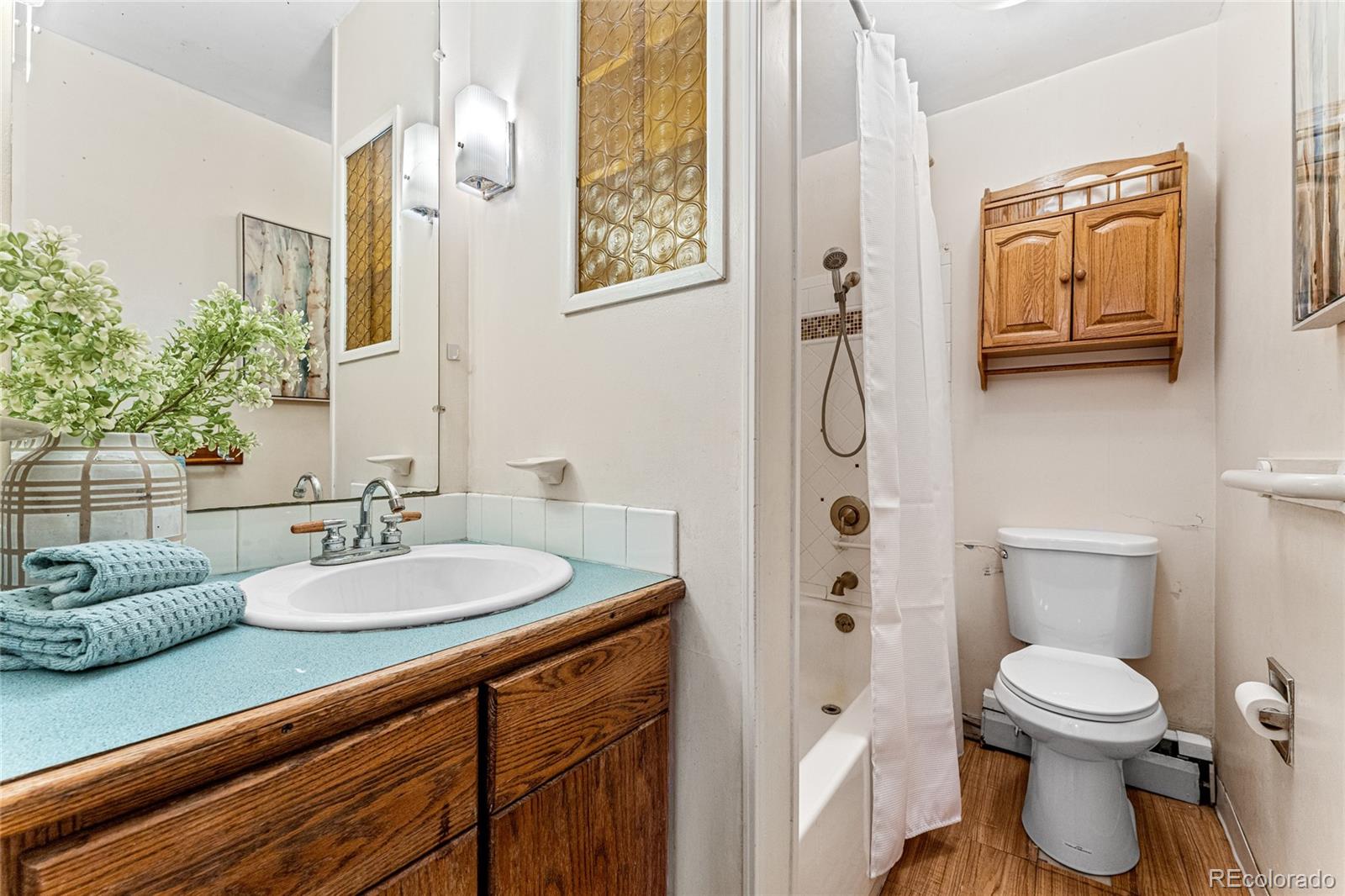 3152 Indian Road Boulder, CO 80301 - Photo 26 of 49 a bathroom with a sink a toilet and shower
