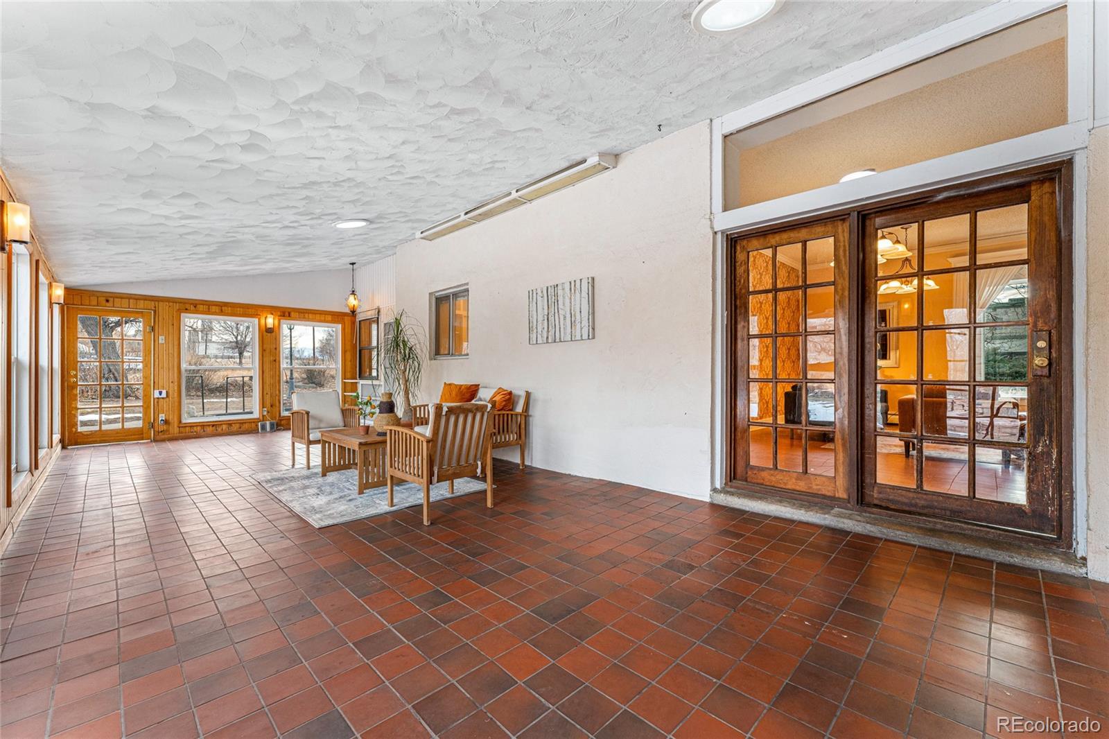 3152 Indian Road Boulder, CO 80301 - Photo 3 of 49 a view of an empty room with furniture and a large window