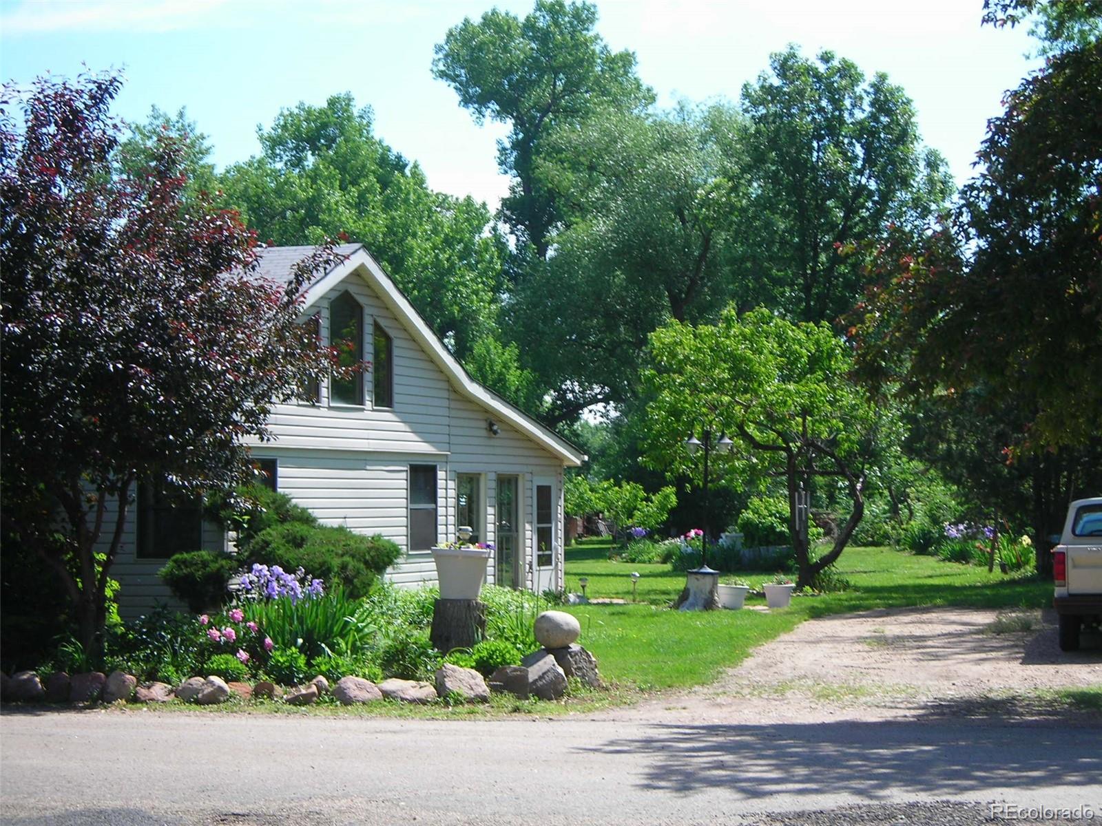3152 Indian Road Boulder, CO 80301 - Photo 32 of 49 a front view of a house with a yard