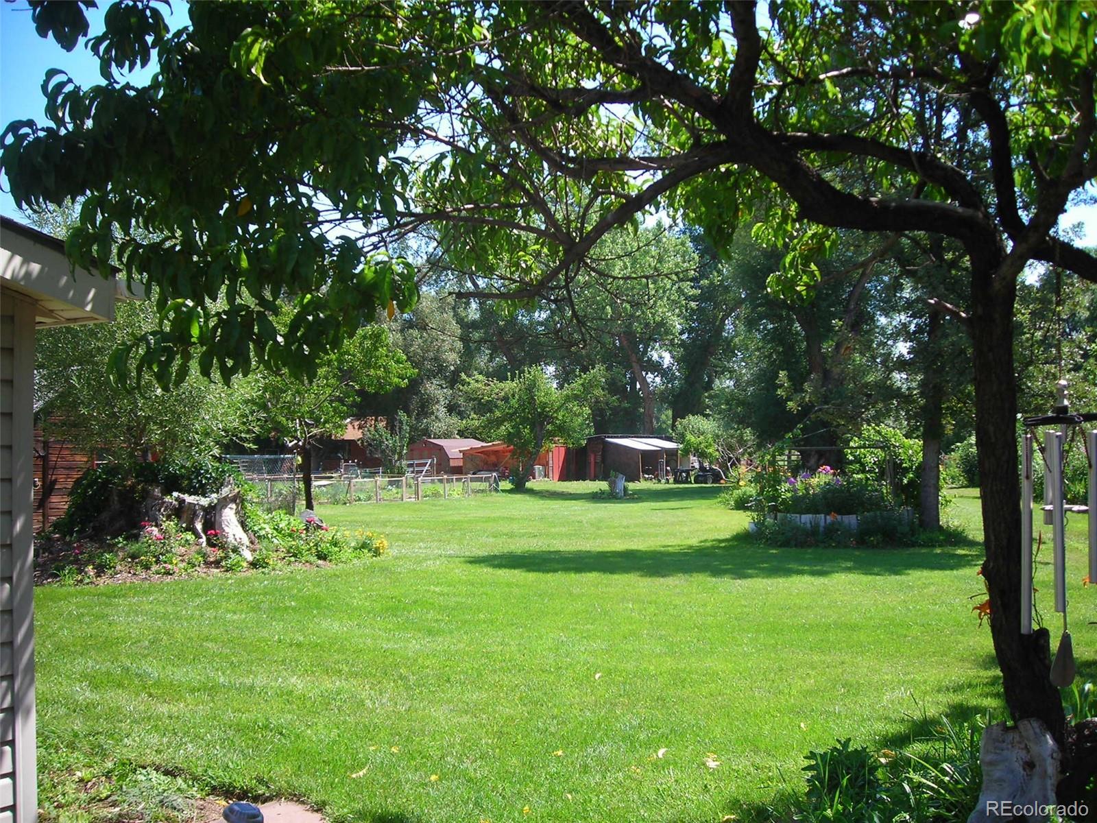 3152 Indian Road Boulder, CO 80301 - Photo 34 of 49 a view of a backyard with a garden and entertaining space