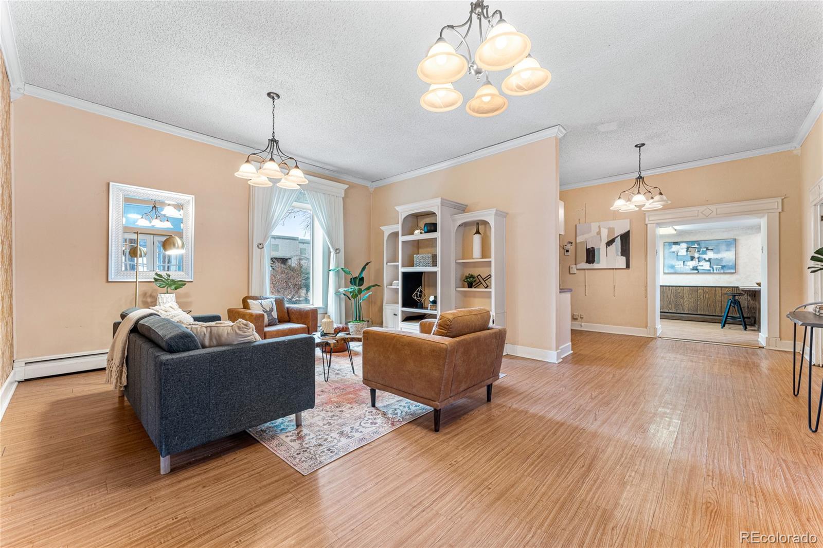 3152 Indian Road Boulder, CO 80301 - Photo 6 of 49 a living room with furniture and a chandelier